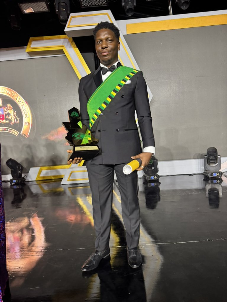 Ebenezer receiving an award